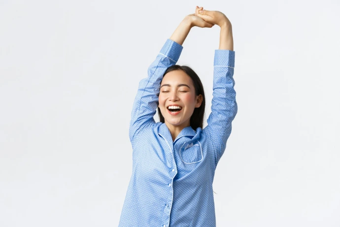 a woman with her arms in the air